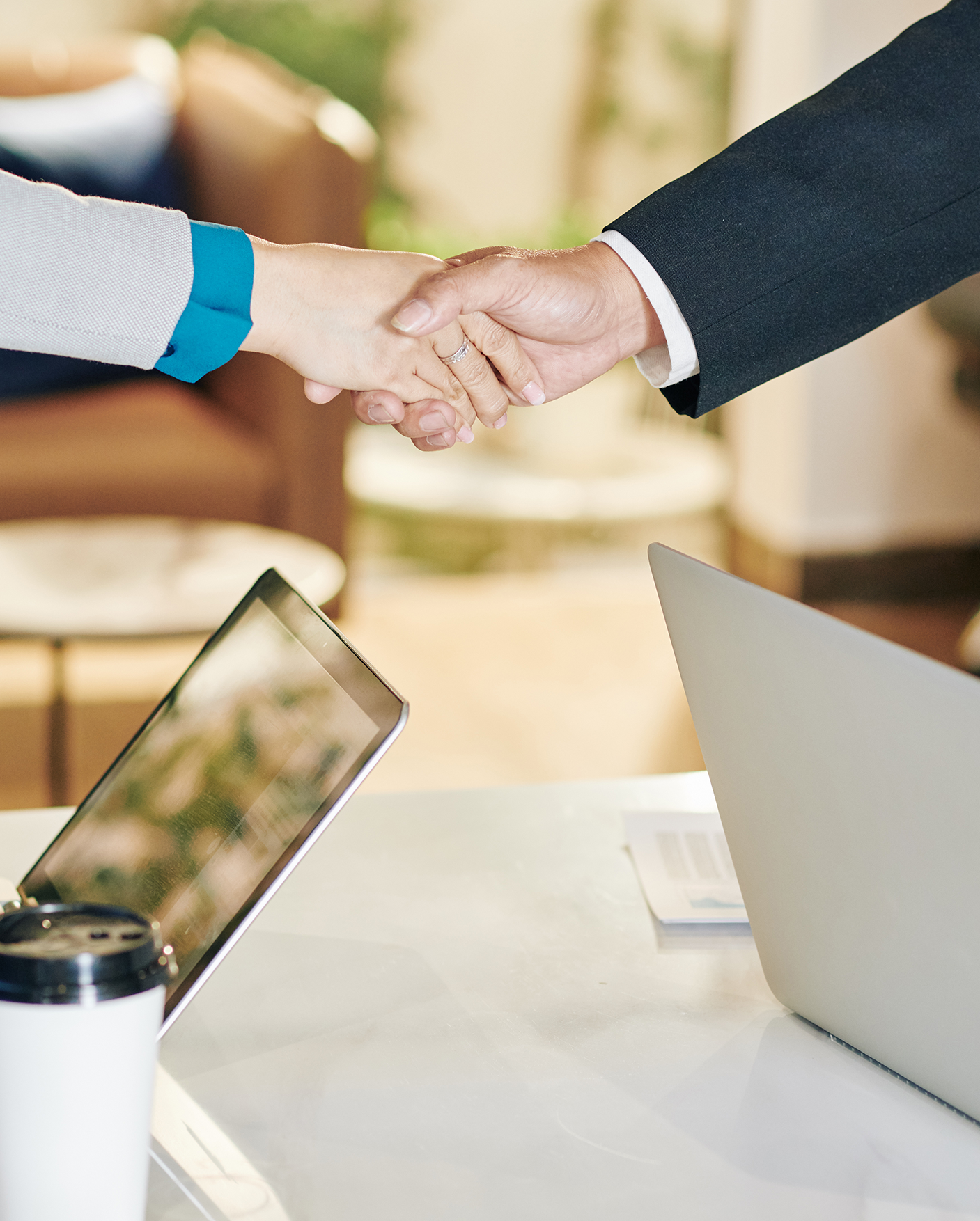 narrow handshake A photograph of two business people shaking hands